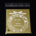 10 cellofaan zakjes met plakstrip goud We wish a merry christmas